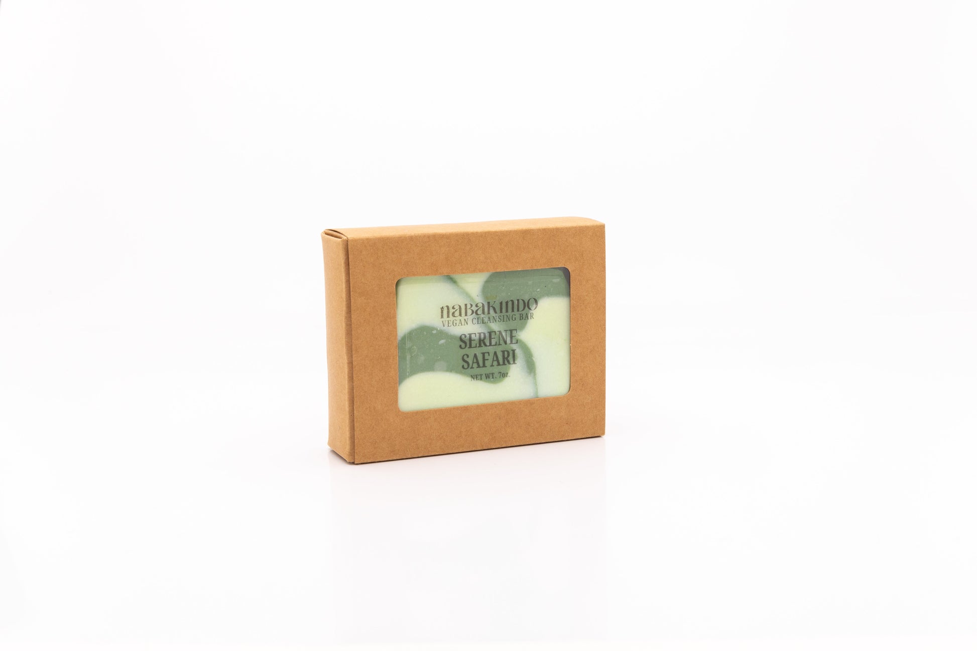 Photo of a white and green swirled colored, vegan, facial and body cleansing bar shown in sustainable packaging.